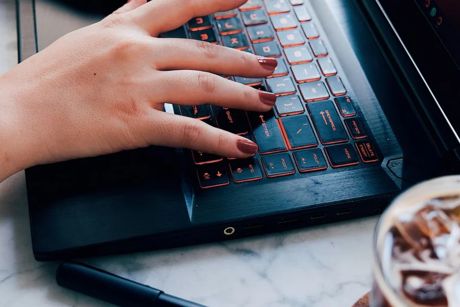 AI-powered story writing Writer typing a creative story on a laptop using AI tools