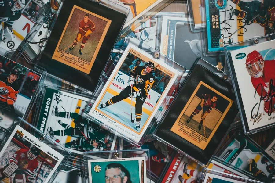Sports Card Collector Break sports card hobby collection packs and memorabilia on desk