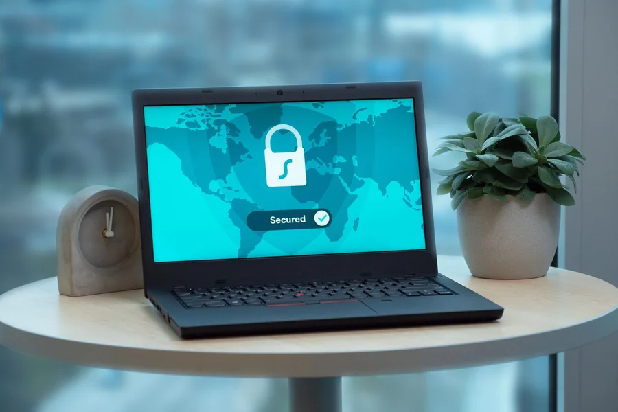 Cybersecurity Shield Digital Safety laptop screen displaying digital cybersecurity warning lock and red shield alert