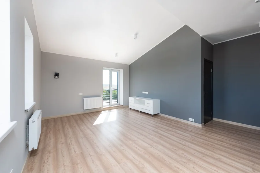 Freshly Painted Modern Bedroom bright modern bedroom with freshly painted gray walls and natural sunlight
